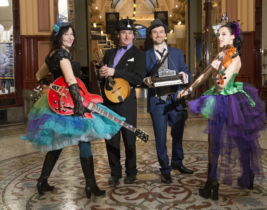 Band posing with instruments in the Block Arcade