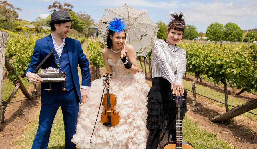 Band with parasol in a vineyard